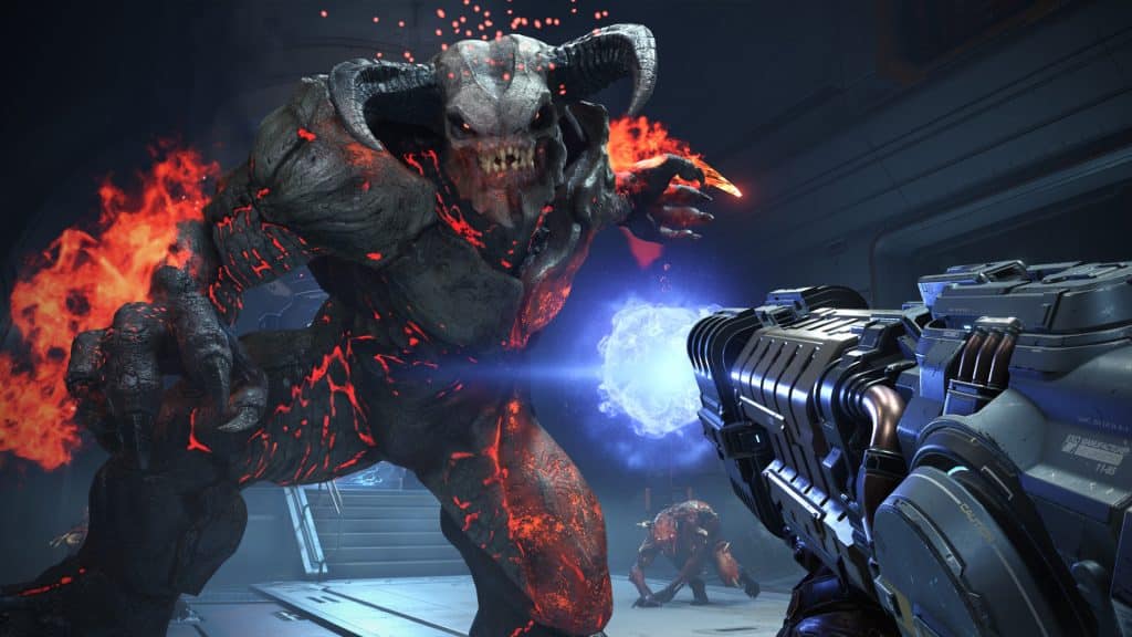 Doom Eternal Screenshot, der viser spilleren, der kæmper mod en stor fjende