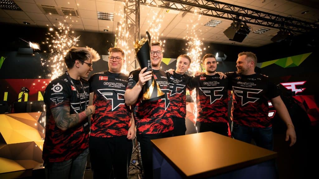 FaZe Clan CS:GO team lifts the PGL Antwerp trophy together with sparklers in the background