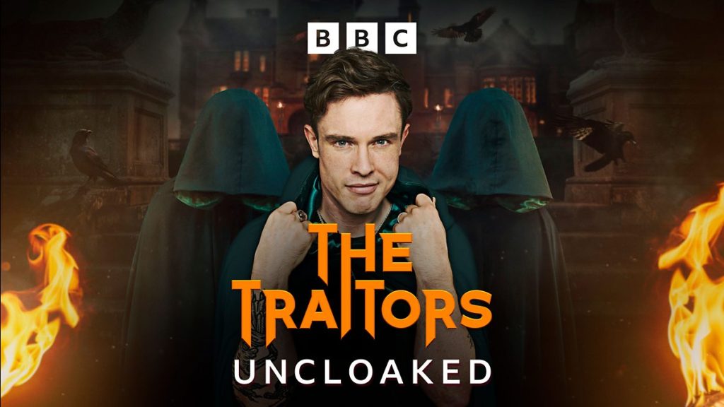 Comedian Ed Gamble in a Traitors cloak.